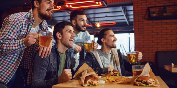 Image of punters at club pub watching nrl afl grand final